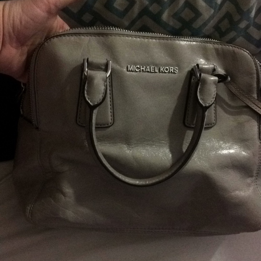 A gray purse Michael kors